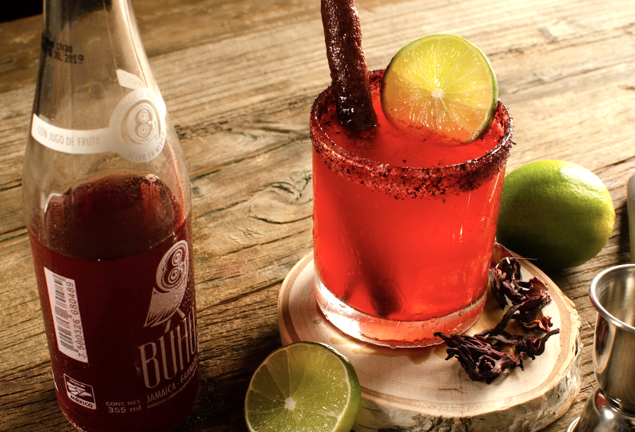 A glass of Buho Soda with Lime and Cinamon on a table