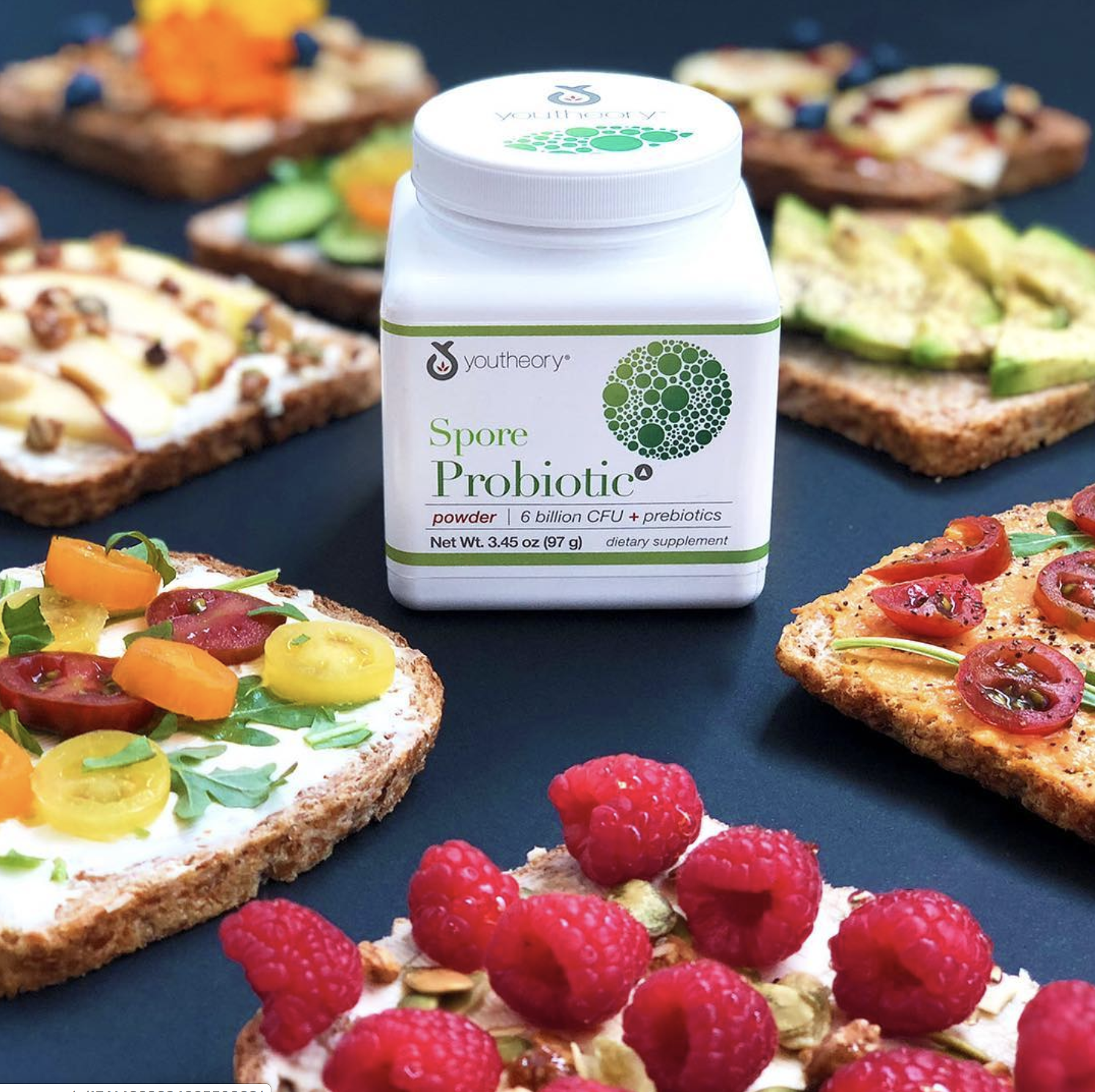 Youtheory probiotic powder surrounded by healthy snacks